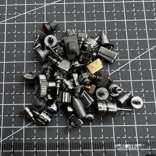 Set of approx. 50 mixed watch push buttons for watch repairs and replacements, brand-neutral.