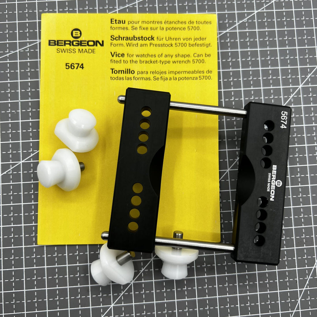 Swiss Bergeon 5674 watch case vice with vise jaws holder for precise watch repair tasks.