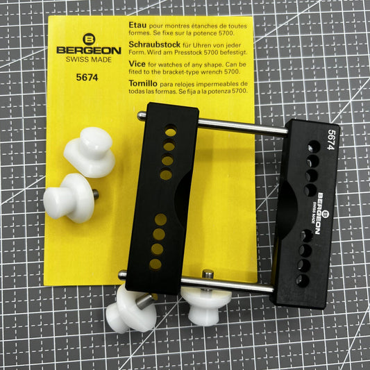 Swiss Bergeon 5674 watch case vice with vise jaws holder for precise watch repair tasks.