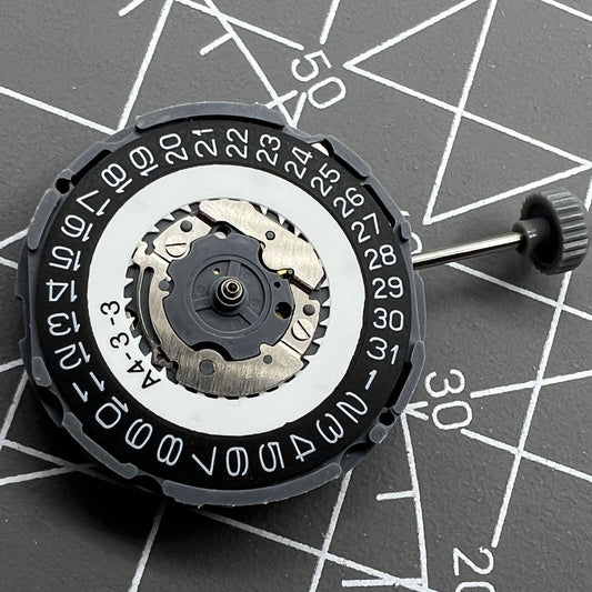 Miyota 6L76 black quartz watch movement disc, Japan-made, for precise timekeeping and repair.