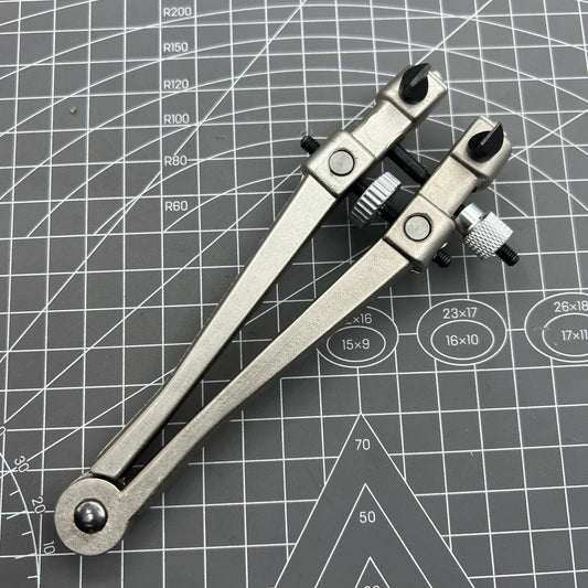 Watch case back opener tool by Uhrengeh�use, ideal for precise watchmaker repairs and maintenance.