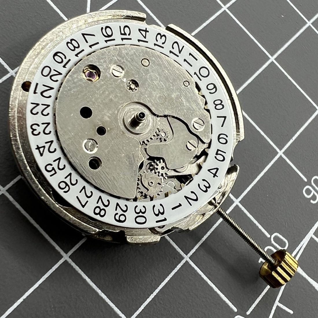 26.5mm 7120 automatic mechanical watch movement with single calendar, three-hand design for precise timekeeping.