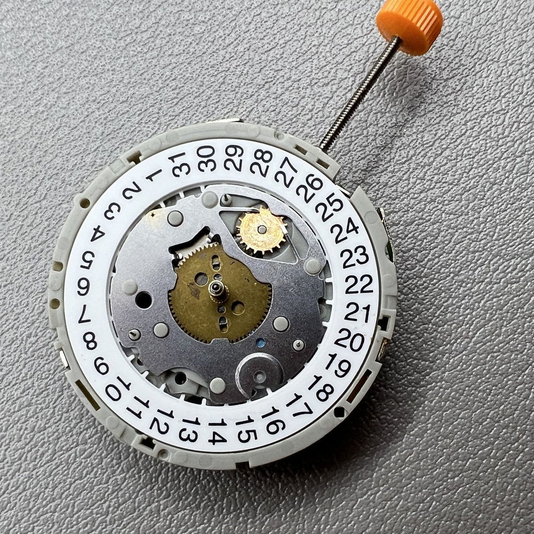 M921 Quartz watch with 3 eye subdials and small second hands at 2, 6, 10 o?clock positions.