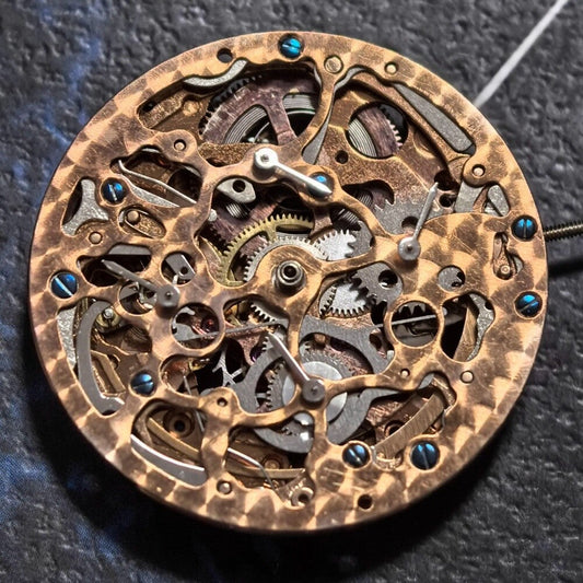 Golden hollow rose watch with mechanical movement, 4 eye subdials, 7 hands, elegant design.