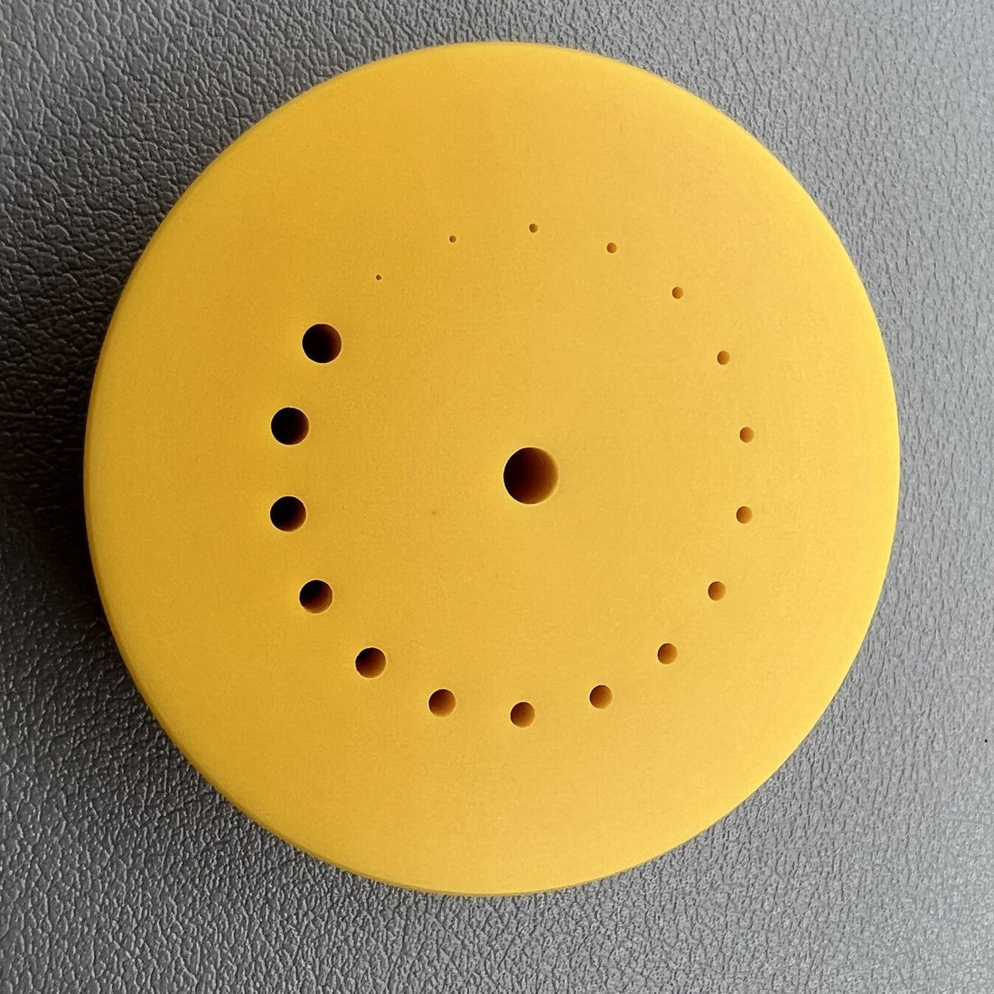 Yellow holder for 45mm watch movement balance wheel and hands, durable accessory.