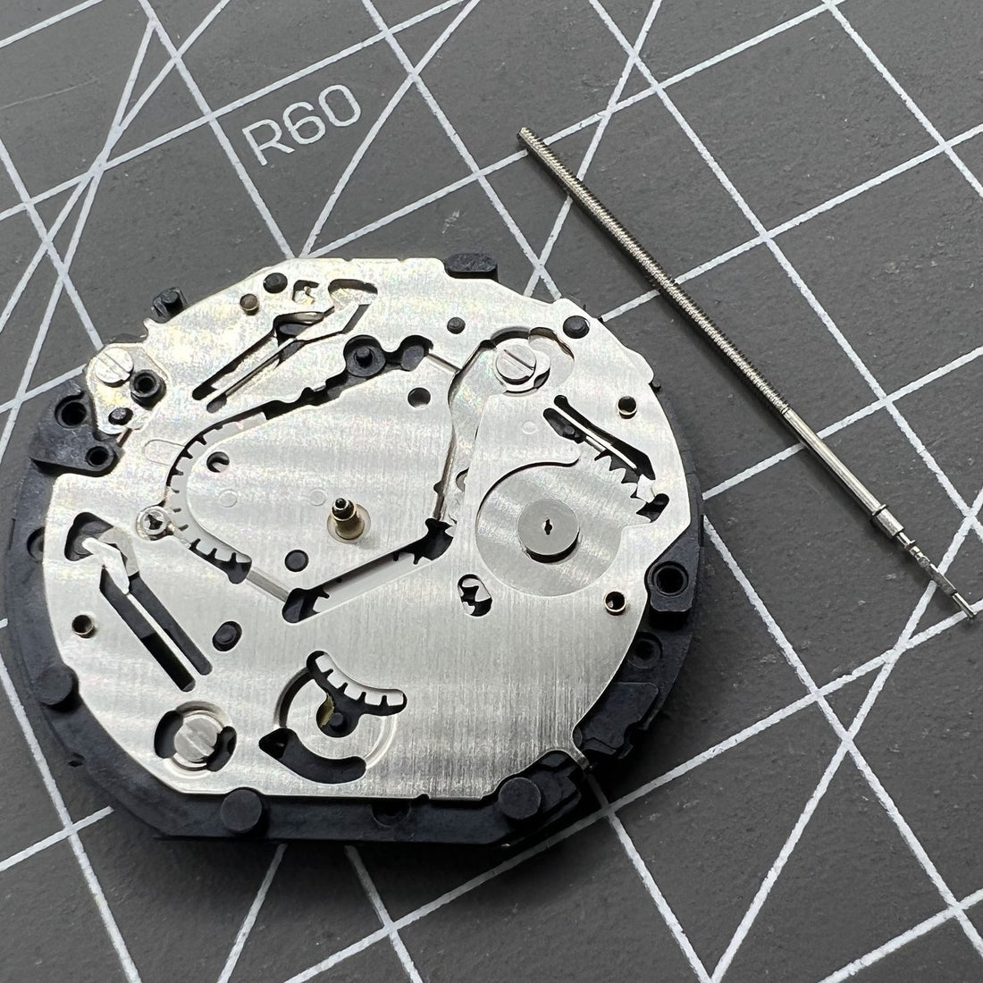 Japan Made Hattori Epson TMI VX7P VX7PE quartz watch movement, precise timekeeping component.