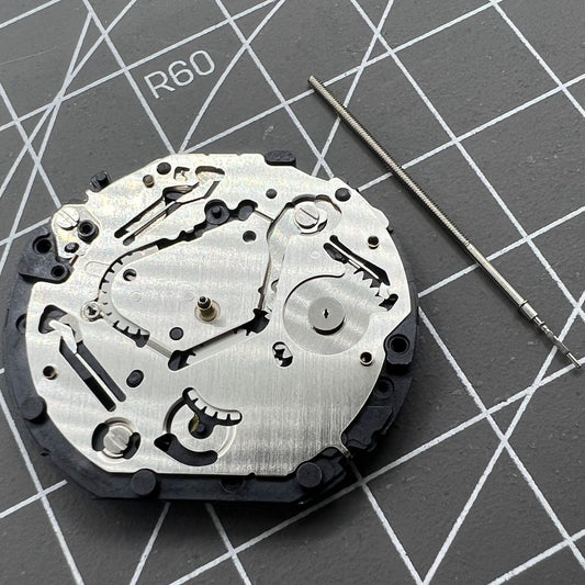 Japan Made Hattori Epson TMI VX7P VX7PE quartz watch movement, precise timekeeping component.