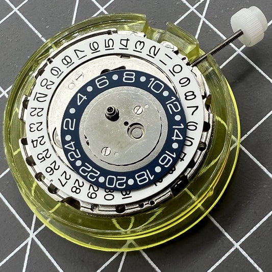 Silver DG2813 watch accessory with automatic mechanical movement and 24-hour display for precise timekeeping.