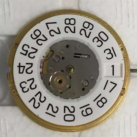 ETA F06.161 quartz watch movement showing three hands and date display at 3 o'clock position, precision timekeeping.