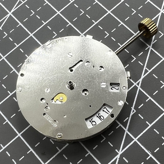 China 8205 automatic watch movement showcasing small second hand at 3 and 9 o'clock, precise mechanics.