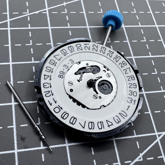 Japan 5F10B quartz watch movement displaying hour, minute, and second hands for precise timekeeping.
