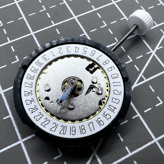 Ronda 585 Swiss quartz watch movement with date display at 6 o'clock, precise and reliable.