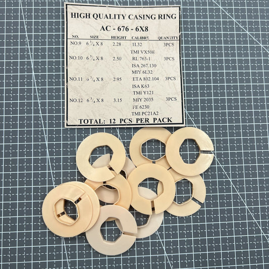 Set of 12 AC-676-6X8 watch movement spacer rings for secure casing in repair.