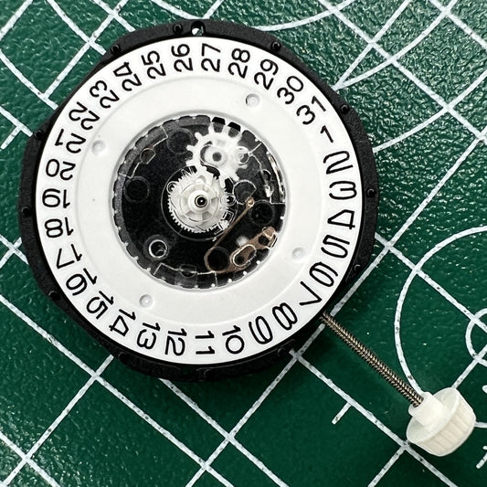 LG32 quartz watch movement with date at 3, ideal for precise repairs and replacements.