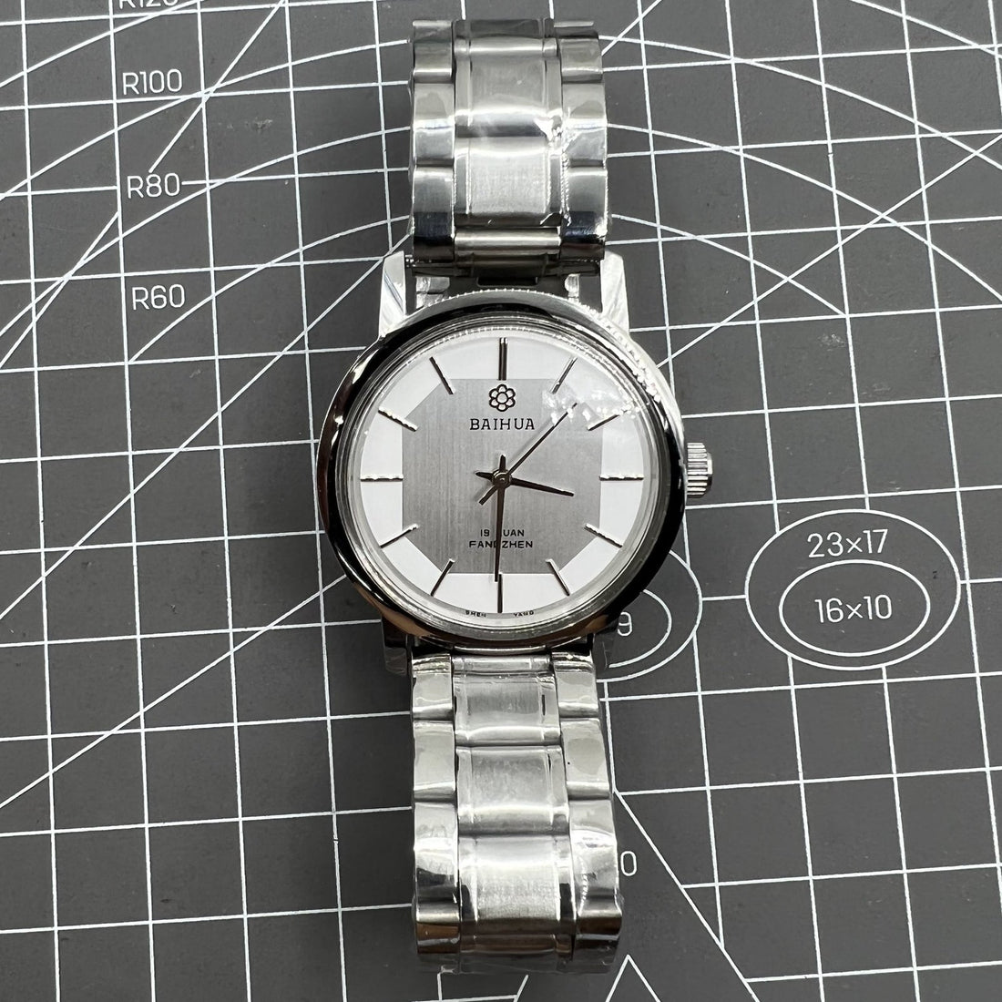 China Baihua 37mm manual mechanical watch with silver dial and 19-jewel shock-resistant movement.