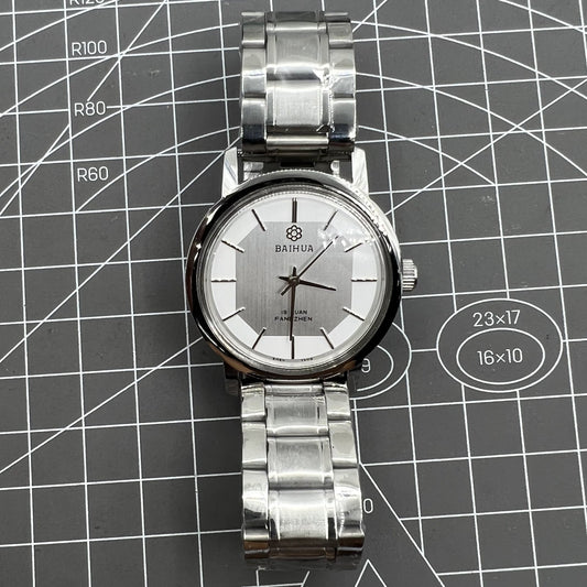 China Baihua 37mm manual mechanical watch with silver dial and 19-jewel shock-resistant movement.