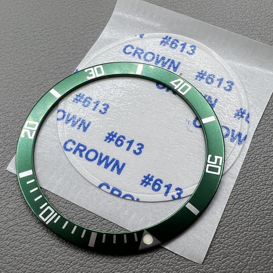 Green aluminium watch bezel insert by Out/in, fits 39mm and 32mm watches, perfect for customization.