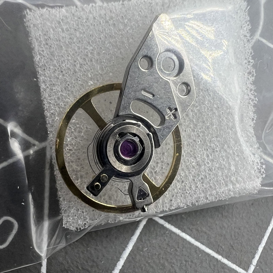 Silver complete balance wheel with splint compatible with Miyota 8N24 movement, crafted in Japan by Miyota.