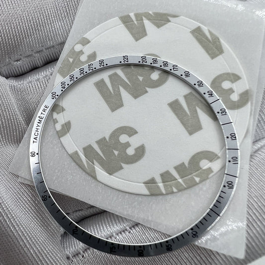 38.5mm aluminum bezel with black font for Omega Speedmaster watch, sleek white finish enhancing style.