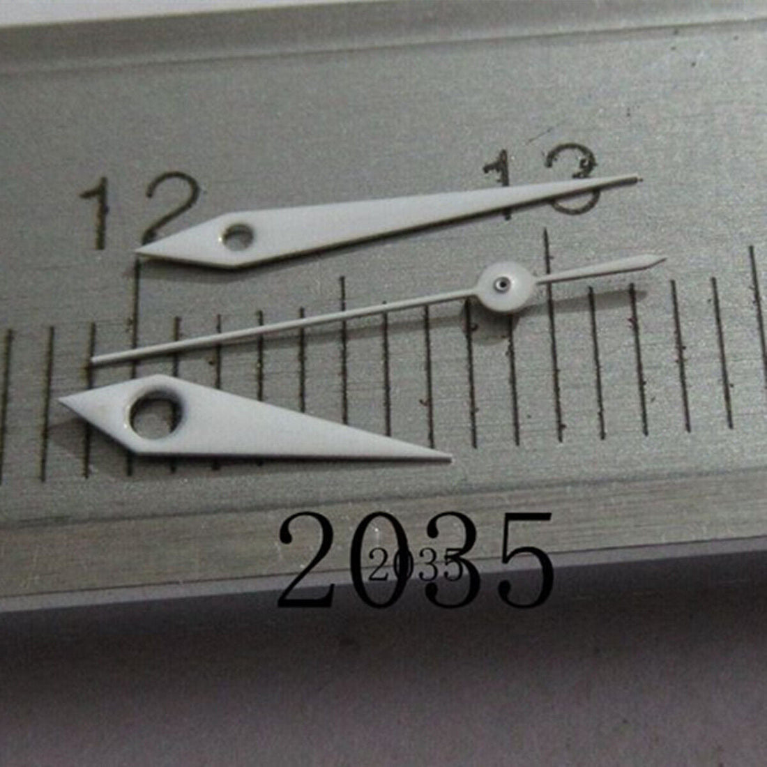 10mm white arrow-shaped watch hand by Miyota, fits models 2035, 2115, 2105, 2305, 2315.