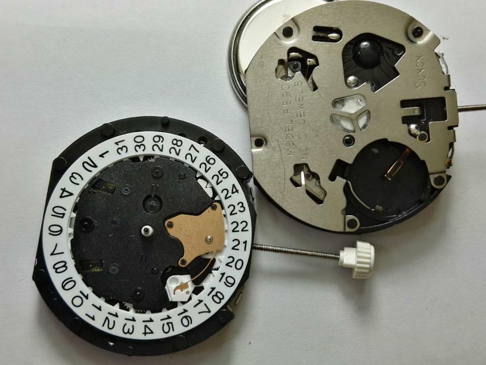 Sunon PE90 watch accessory with quartz movement and small second hands at 6, 9, and 12 o'clock positions.