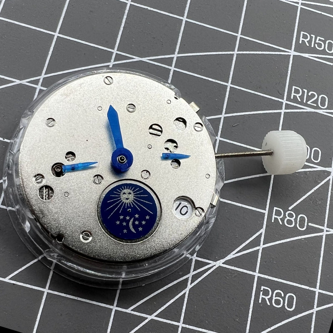 Shanghai Silver Star watch with moon phase at 6 o'clock, automatic mechanical movement, elegant design.
