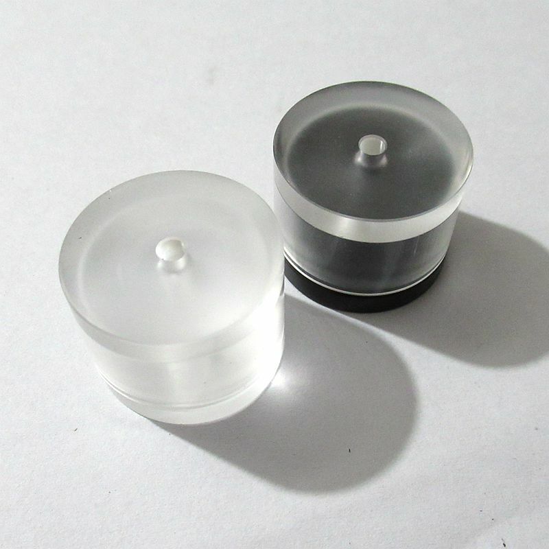 Plastic watch movement repair tool with mainspring pressure case, barrel cover for precise watch accessory maintenance.