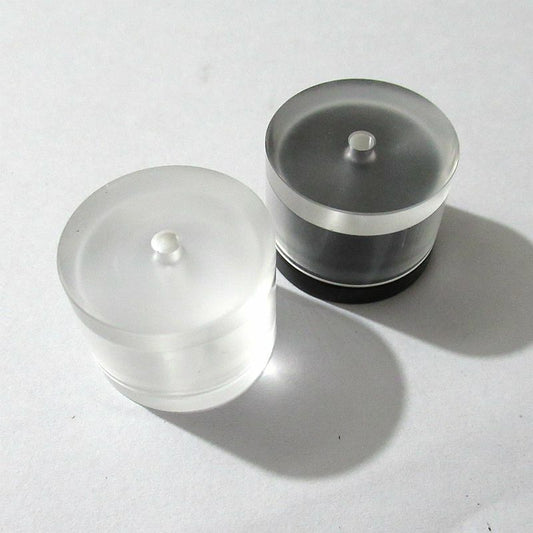 Plastic watch movement repair tool with mainspring pressure case, barrel cover for precise watch accessory maintenance.