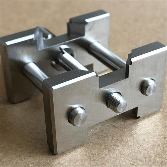 Stainless steel watch movement holder by Brand New, perfect for precise watch repair tasks.