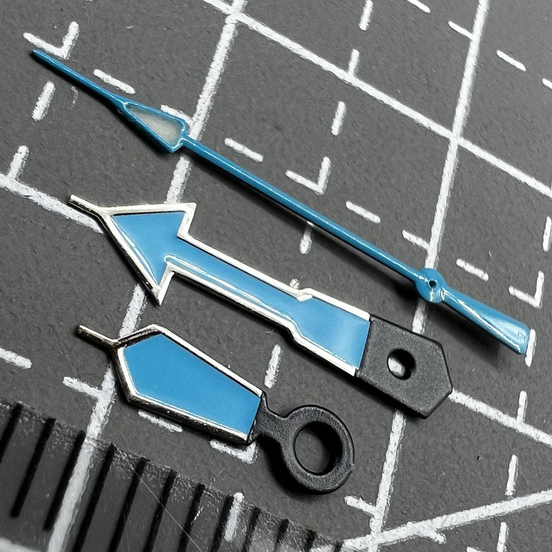 Seiko NH35 watch movement with blue hands, green luminescence, and dark silver edge detailing for premium style
