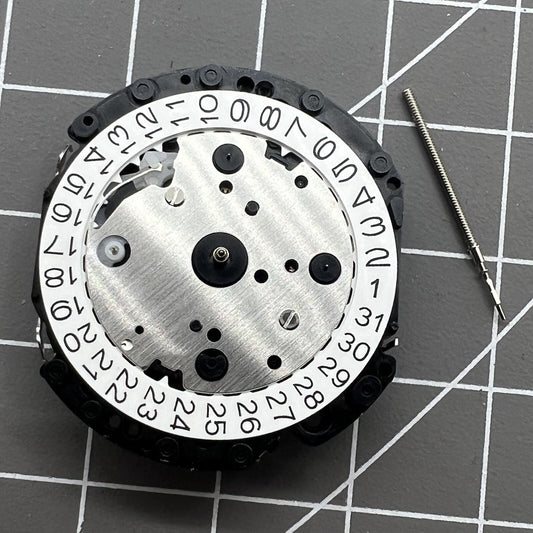 Japan Made Hattori Epson TMI VD53 quartz watch movement with date display at 3, 6, and 4:30 positions.