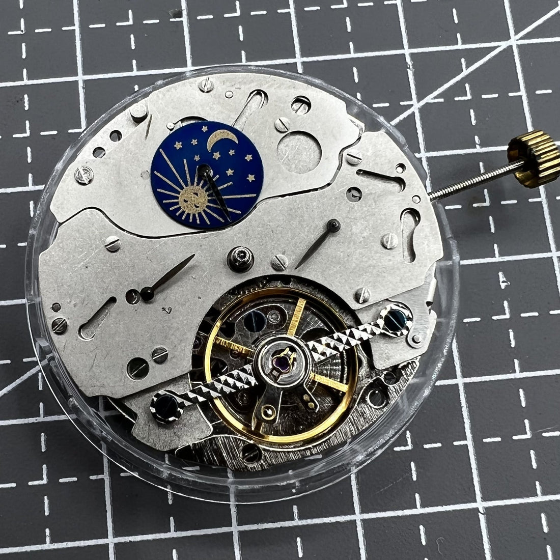Automatic multifunction watch with mechanical movement and moon phase display at 12 o'clock, elegant design by [Brand Name].