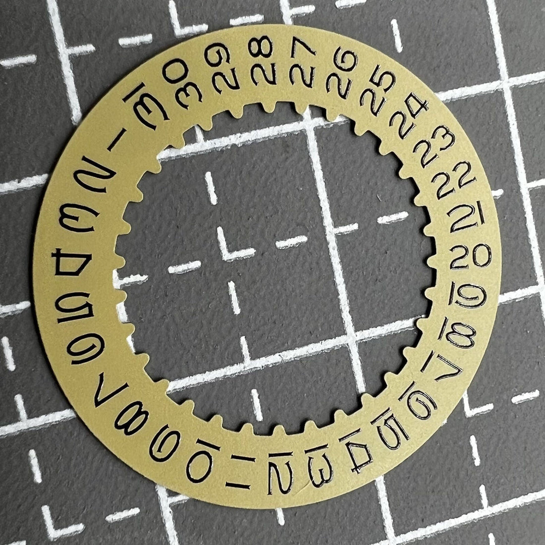 Golden vintage numeral date disk wheel for RLX3135 watch movement, enhancing classic watch designs.