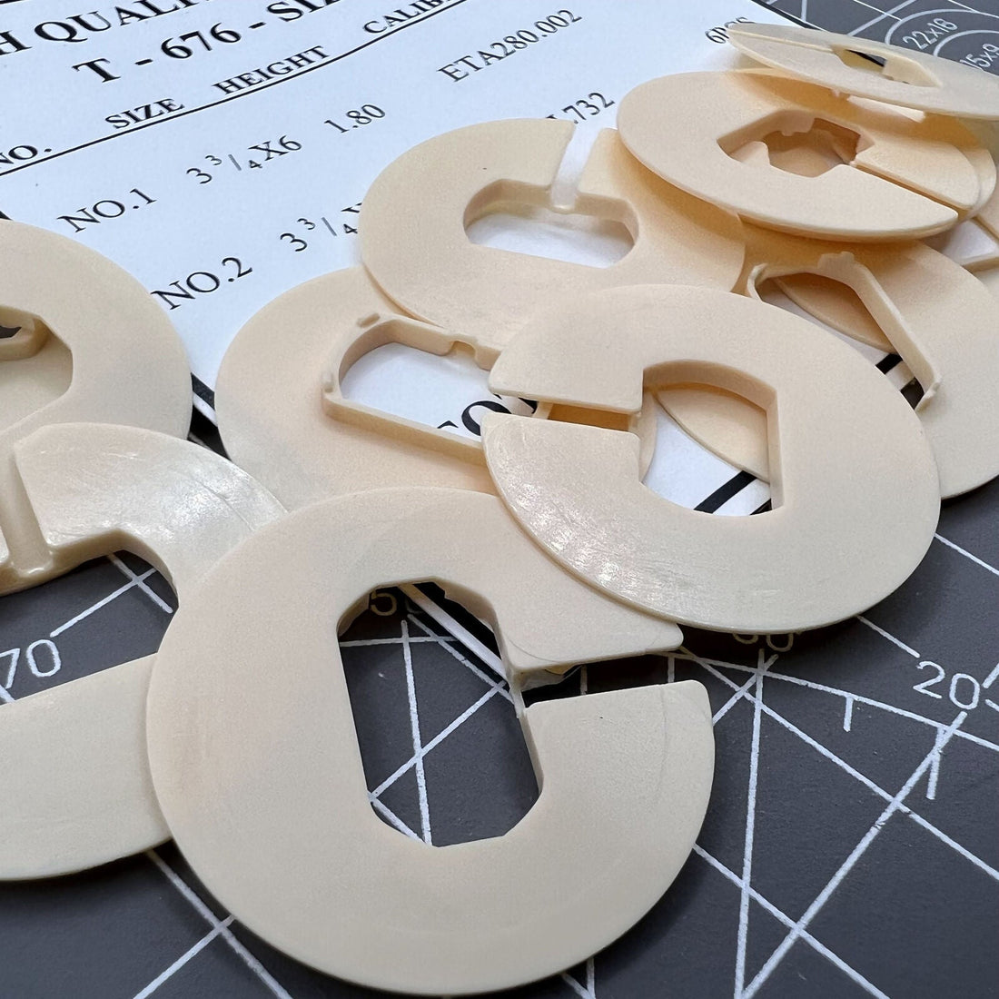 Set of 12 plastic watch movement holder spacers, compatible with 280.002 RL732 models for secure casing.