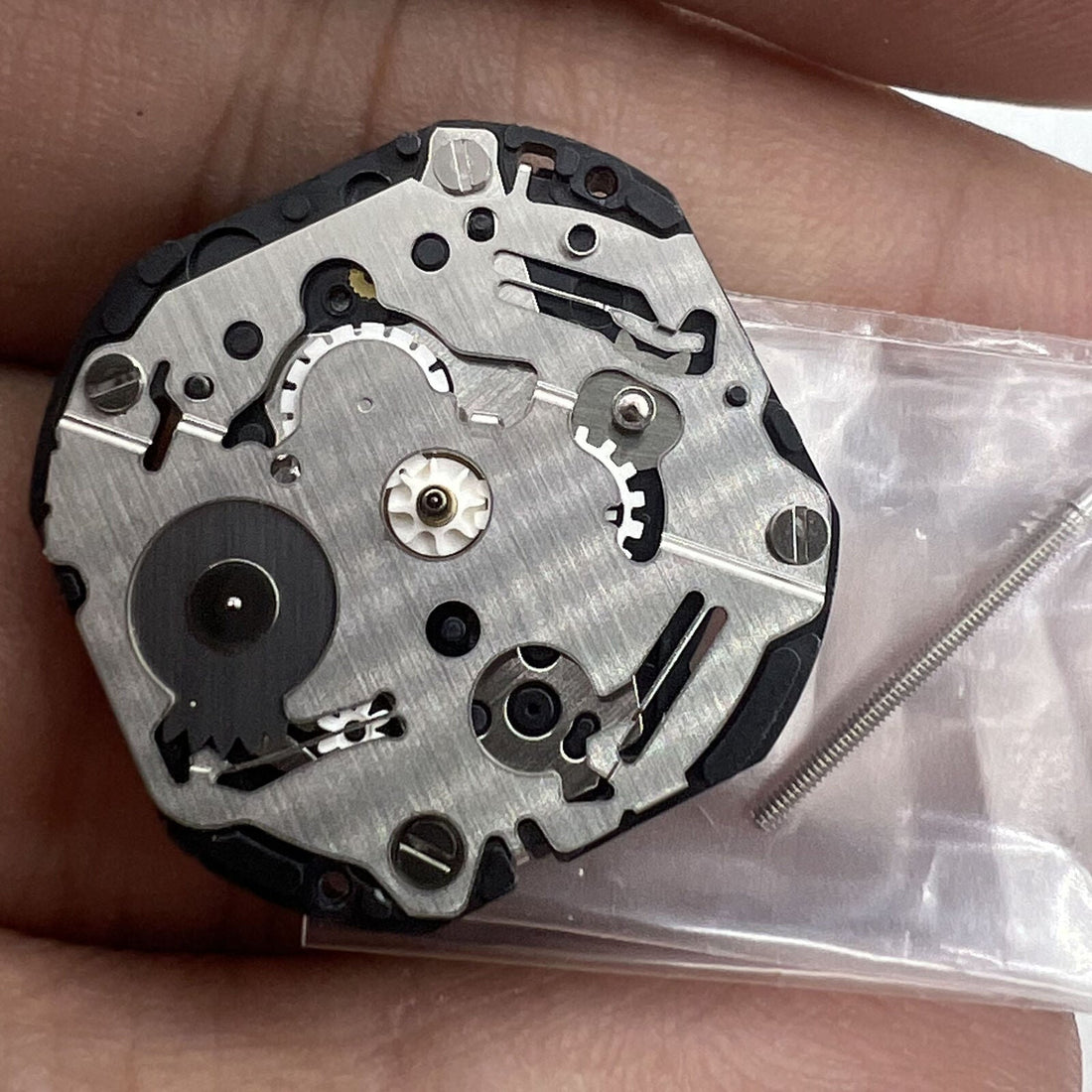 Hattori Epson TMI VX36E quartz movement for precise watch accessory repairs and replacements.