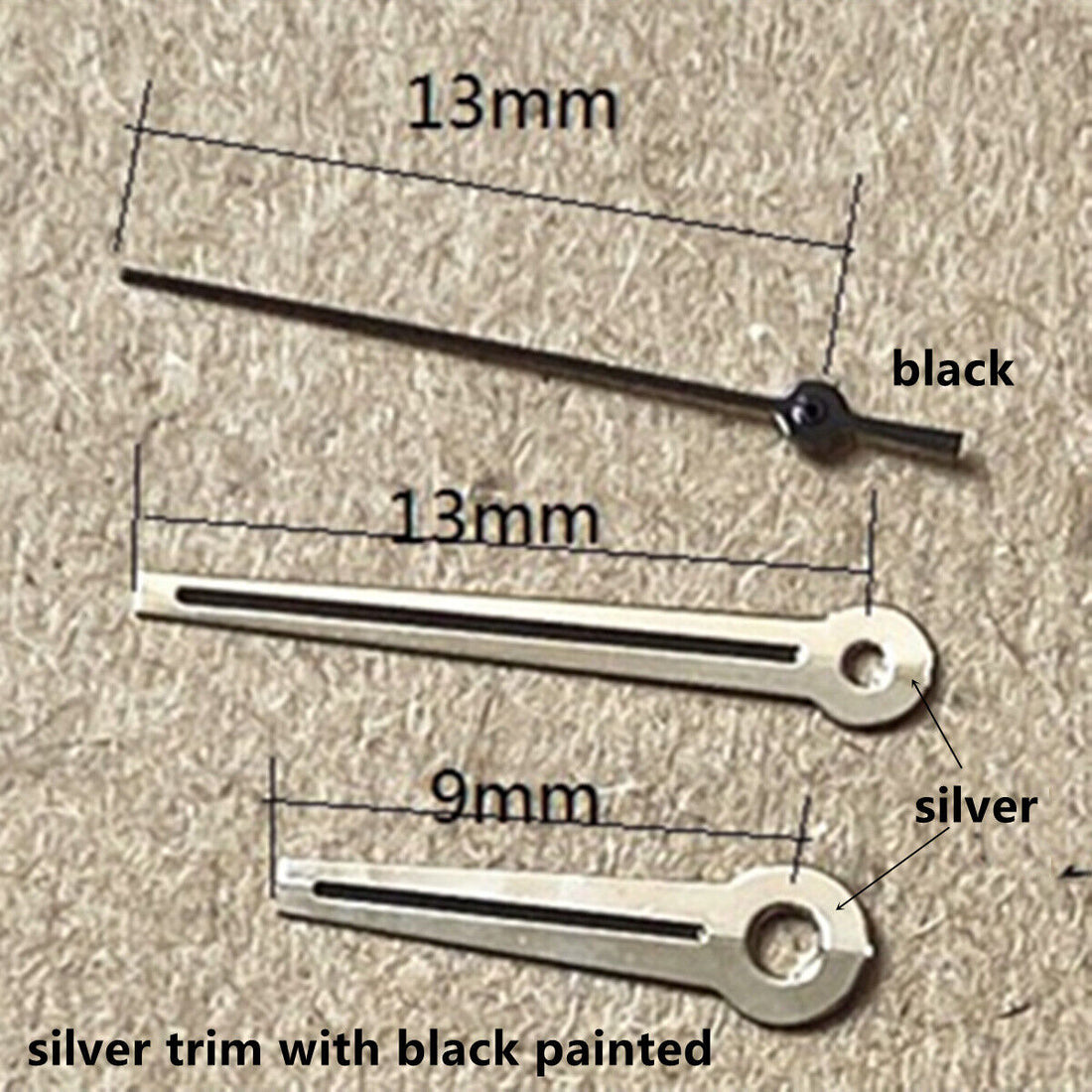 Silver 13mm watch hands with black paint, compatible with Ronda 515 quartz movement, sleek design.