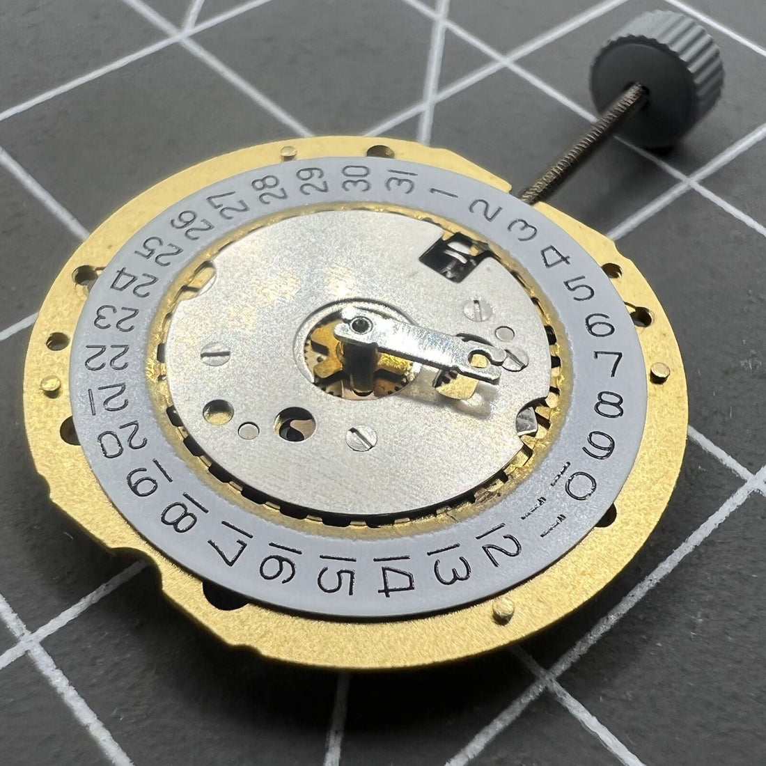 Swiss Ronda 785 quartz watch movement with date at 4 o'clock, 3 hands, precise timekeeping for watch repairs.