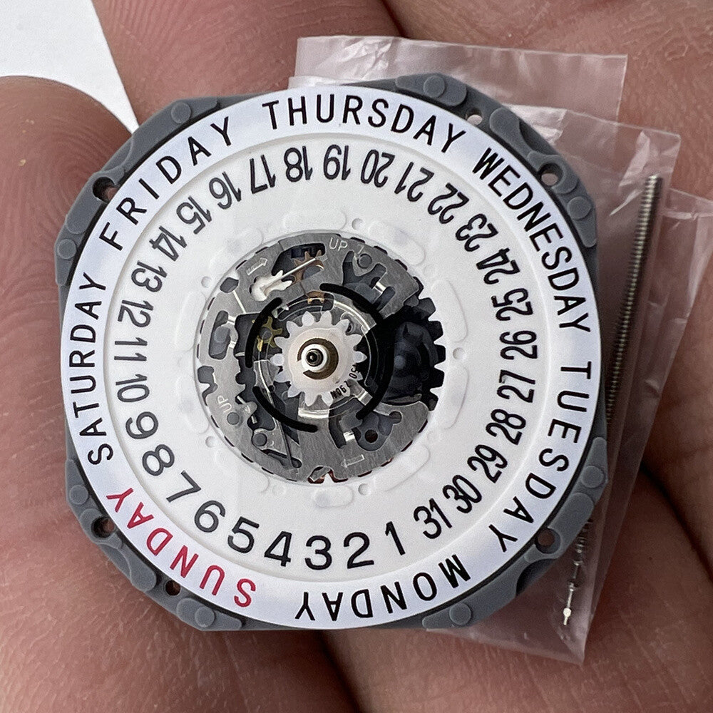 Hattori Epson TMI VJ55 quartz watch movement with date display at 3 and 6, Japan made.