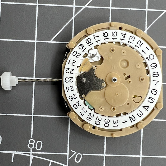 Sunon PE60 watch with date at 3, small seconds at 6 and 9, quartz movement for precise timekeeping.