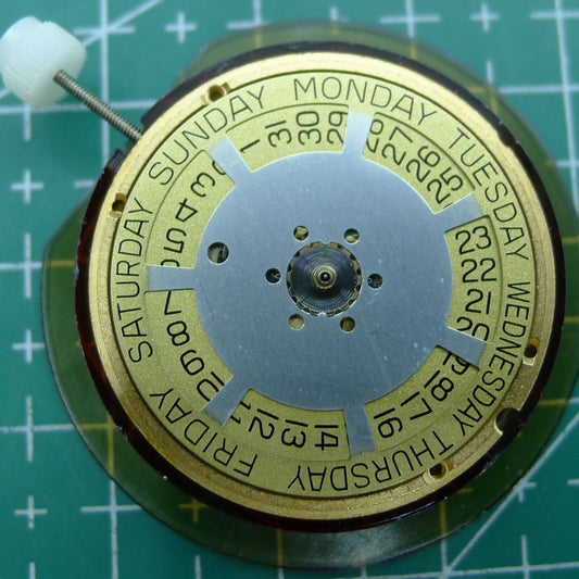 Wholesale Swiss Made ETA 955.132 quartz watch movement showing double calendar with week at 12 and date at 3 positions.