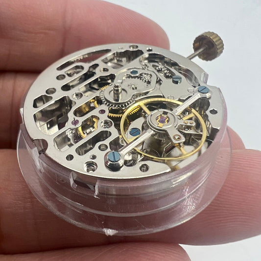 Dandong Hollow automatic watch with silver movement and small seconds at 9 o'clock, stylish accessory.