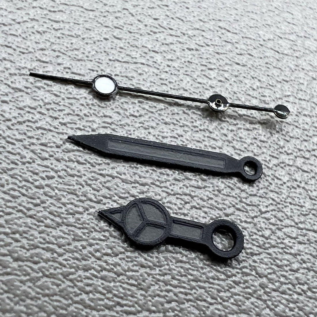 Set of 2 black second watch hands with matte trim and black painted lume for NH35/36.