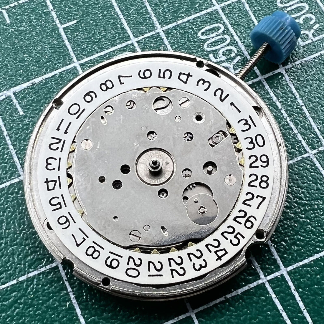Swiss Made ETA 963.116 quartz watch movement with single calendar at 3 o'clock, precision timekeeping.