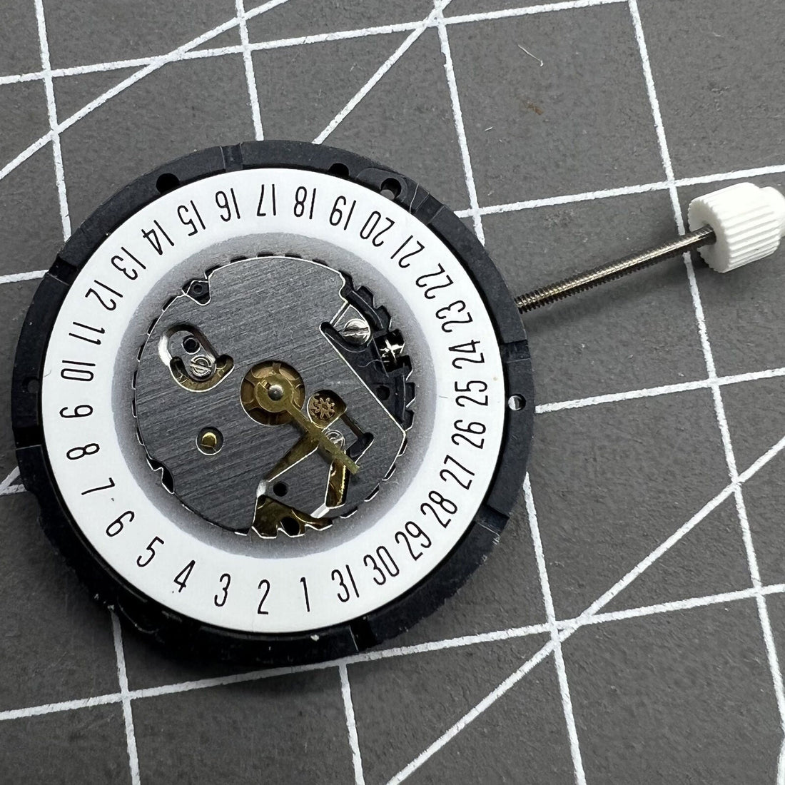 ISA 330 quartz watch movement with date display at 6 o'clock, ideal for precise timekeeping.