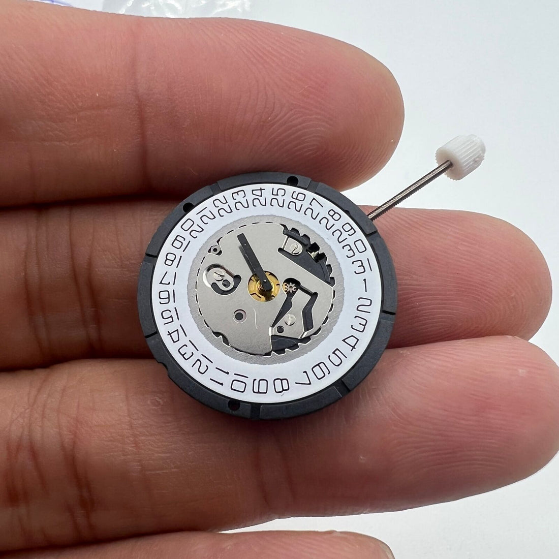 ISA 2330 watch with white dial, quartz movement, date display at 3 o'clock, elegant design.