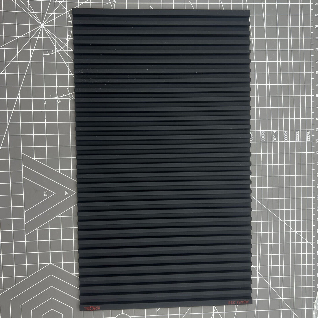 Swiss Horotec MSA24.223 black silicon bench mat with 32 grooves for secure watch accessory handling