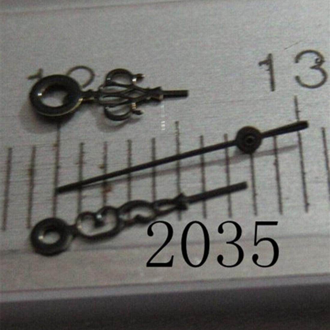 Black painted flower-shaped hollow watch hand for Miyota 2035 series, precise and stylish accessory.