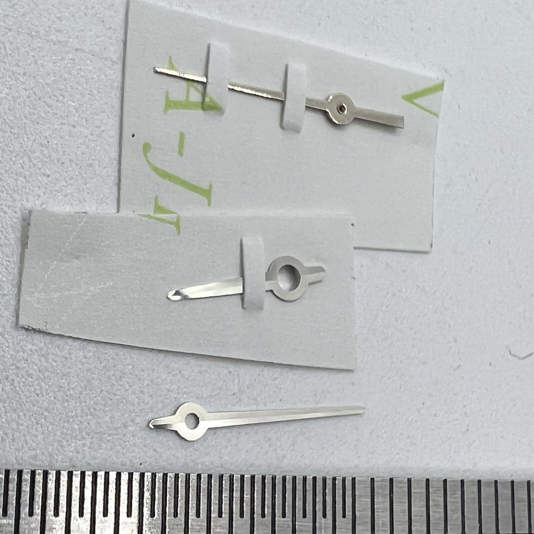 Silver three watch hands set by Ronda for 763 quartz movement, sizes 9.5mm, 9mm, and 6mm.