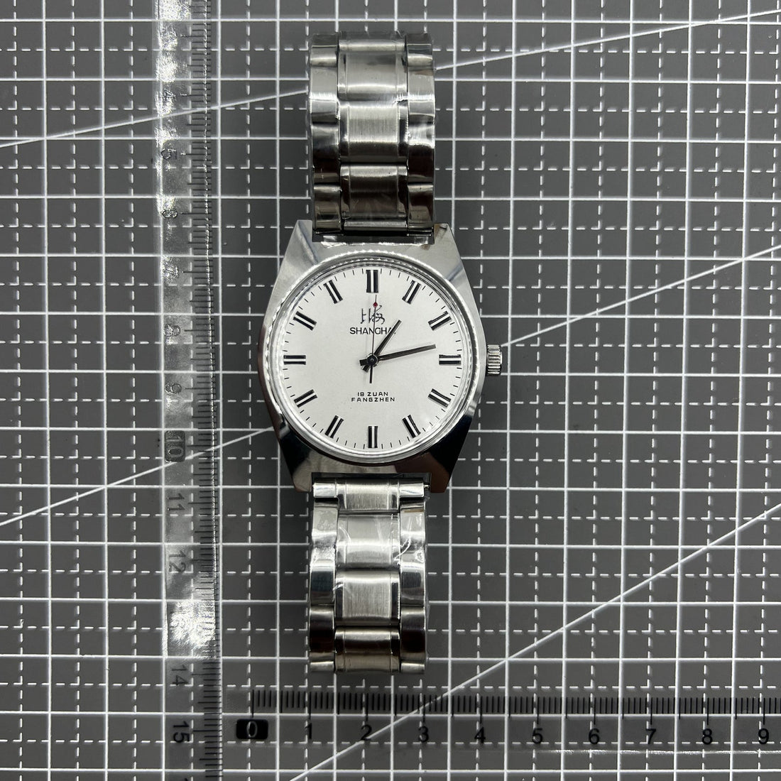 Shanghai 38mm manual mechanical watch with white dial, 3 hands, elegant design by Shanghai brand.