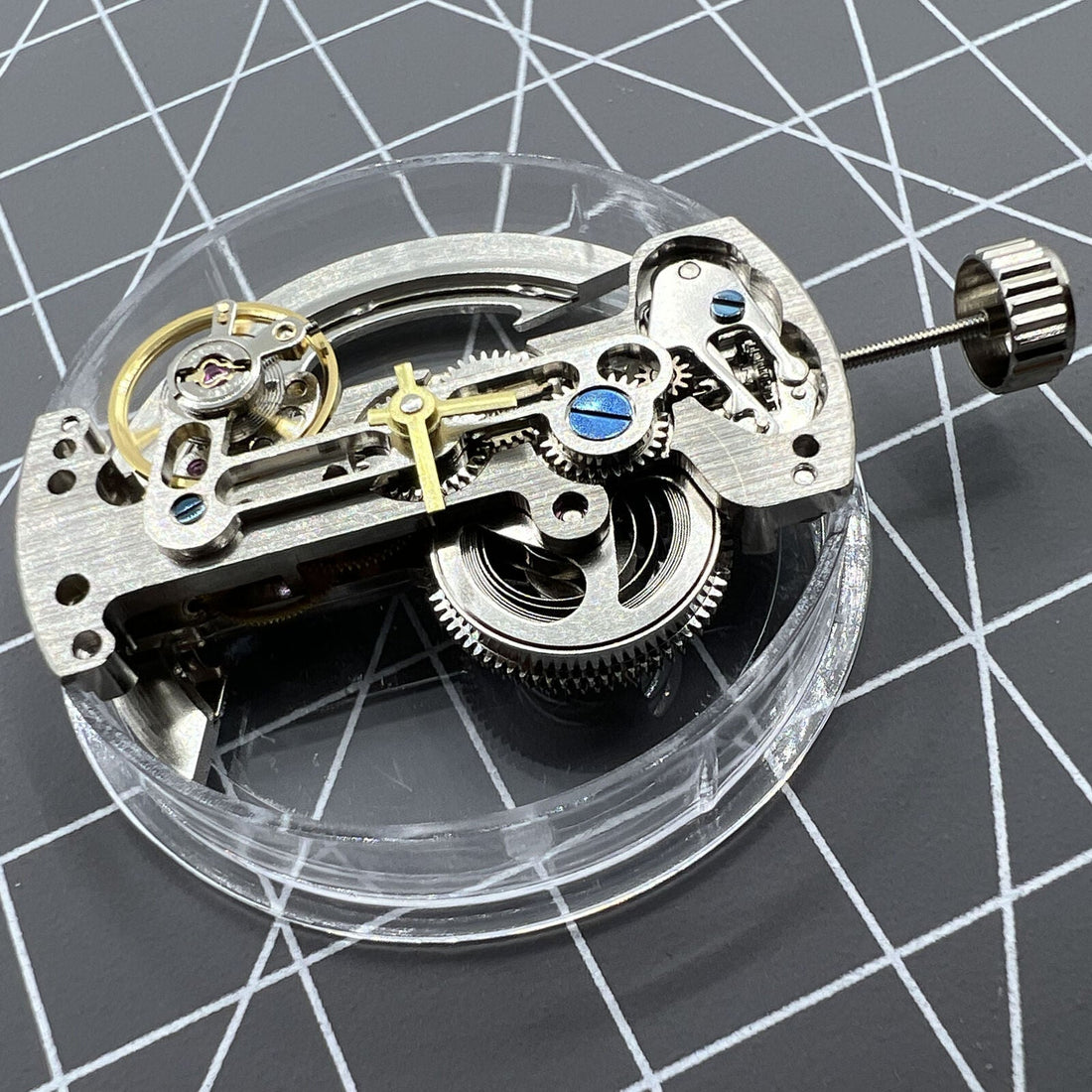 Asian LG0807 silver rectangle watch with visible bare balance wheel and automatic mechanical movement.